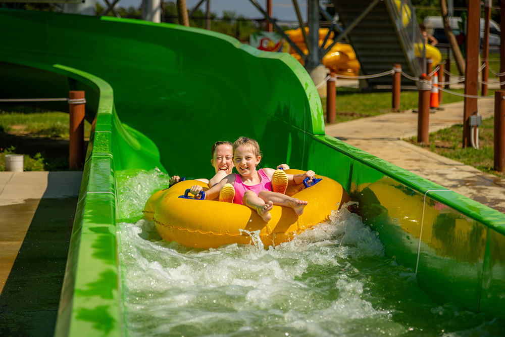 Woman and girl green slide